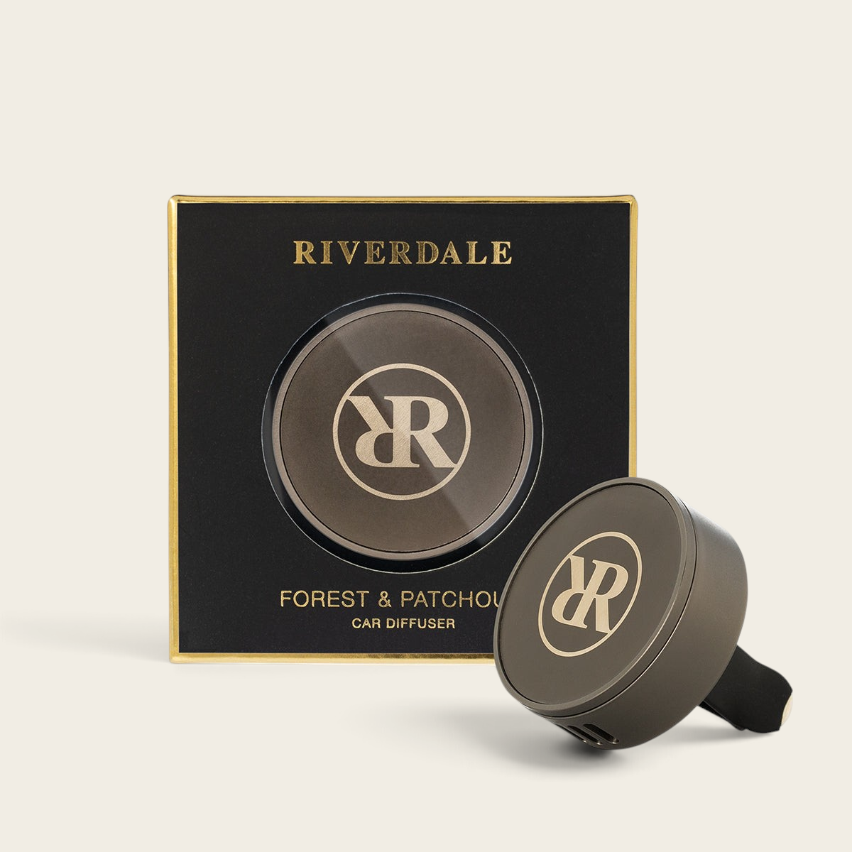 Riverdale Forest & Patchouli car diffuser set with a round metallic holder and branded packaging box
