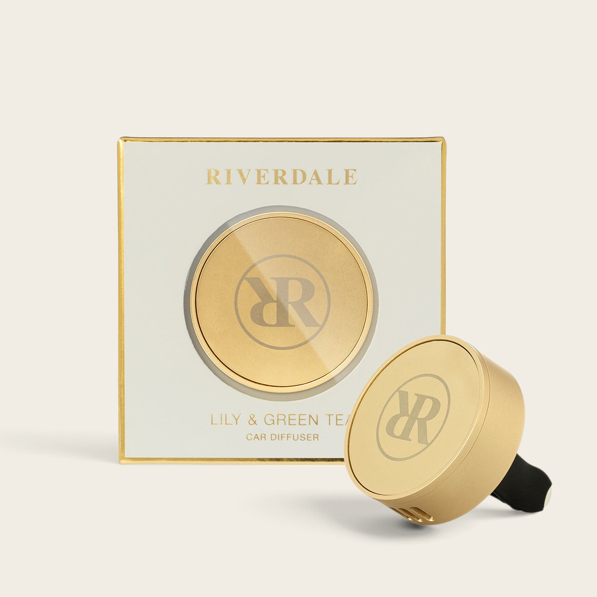 Riverdale car diffuser set with gold holder and Lily & Green Tea fragrance tablets in elegant gift packaging