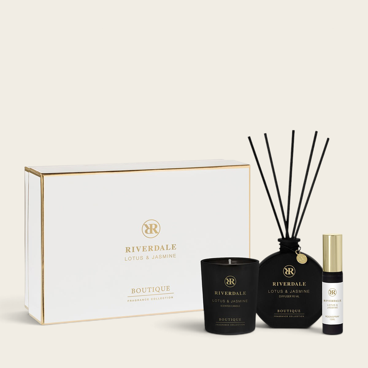 Riverdale Lotus & Jasmine gift set featuring a scented candle, reed diffuser, and room spray in elegant black bottles.
