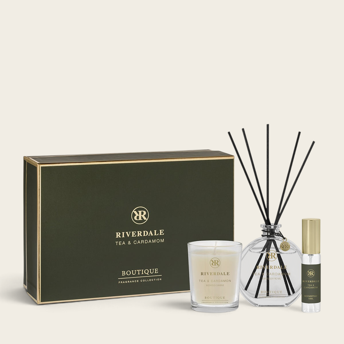 Riverdale Tea & Cardamom gift set featuring a scented candle, reed diffuser, and roomspray in a dark green box.