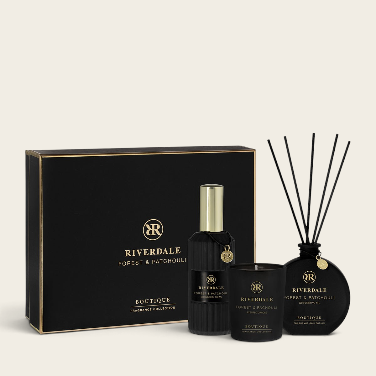 Riverdale Forest & Patchouli gift set featuring a scented candle, reed diffuser, and room spray in black packaging.