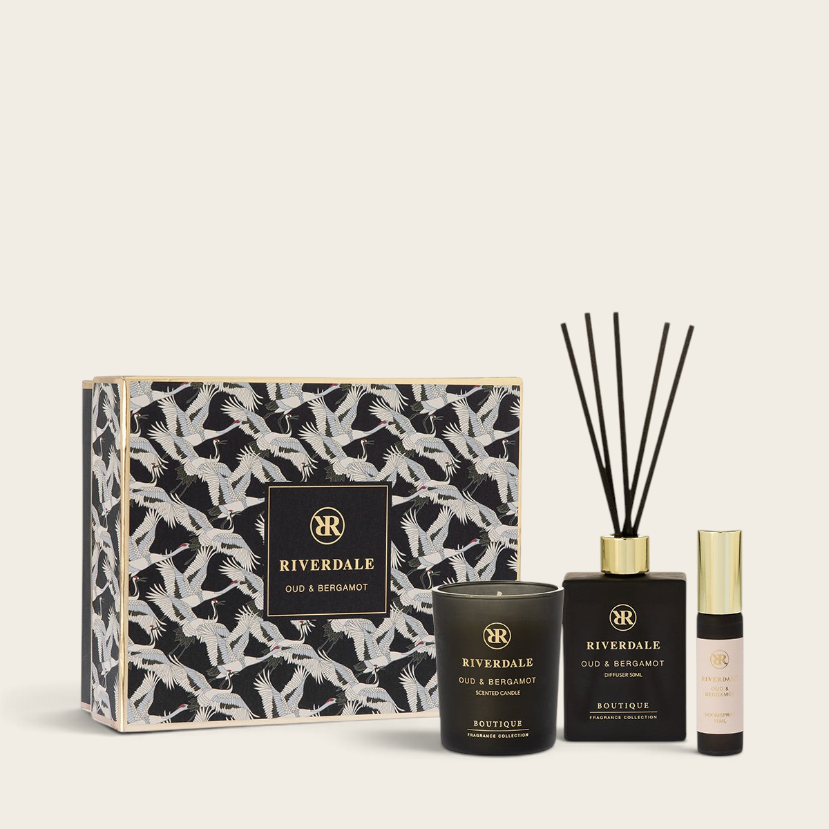 Riverdale Oud & Bergamot gift set featuring a scented candle, reed diffuser, and room spray in a decorative box.