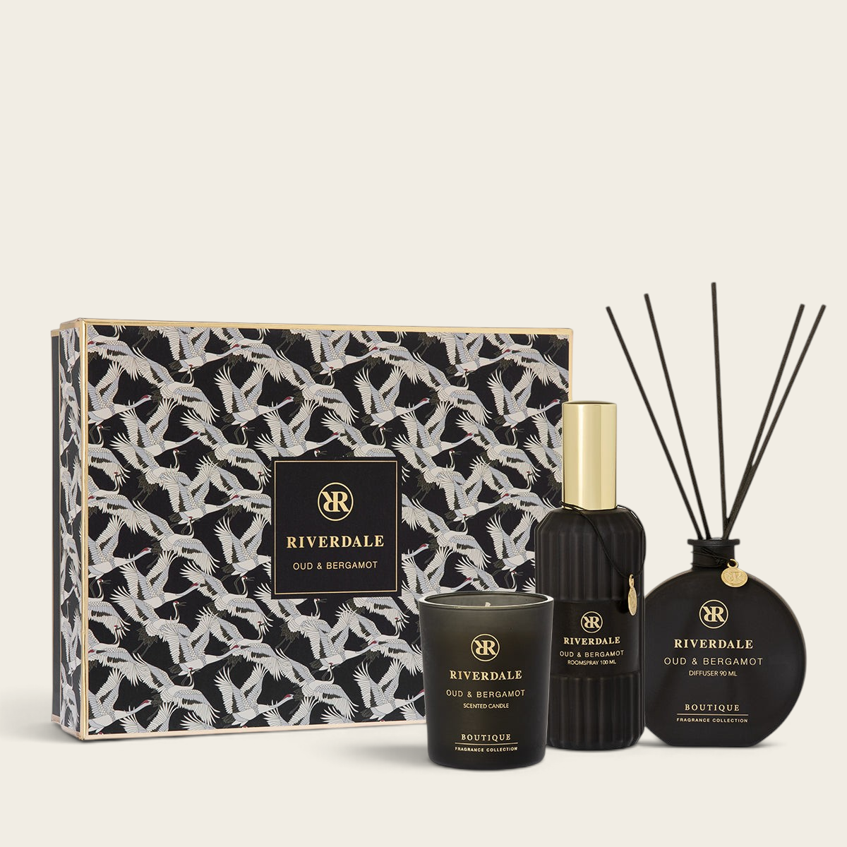 Riverdale Cadeau Olivia L gift set featuring Oud & Bergamot scented candle, room spray, and reed diffuser in a patterned box