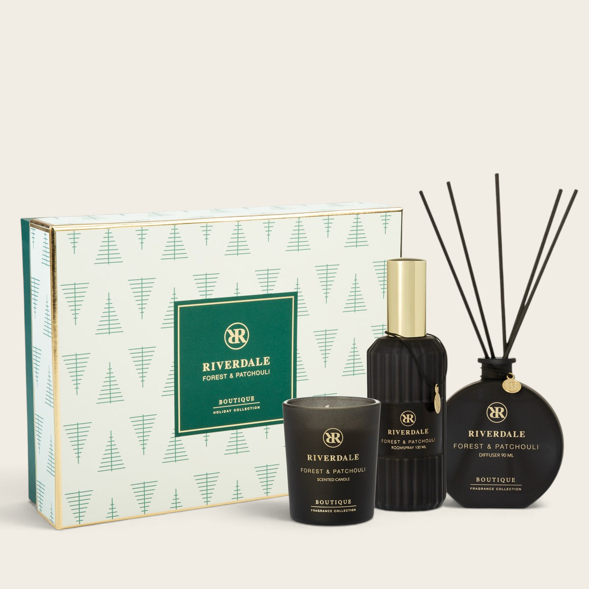 Riverdale Forest & Patchouli gift set featuring a scented candle, room spray, and reed diffuser in a holiday box.