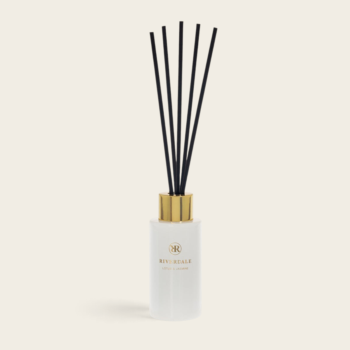 Riverdale Boutique Lotus & Jasmine reed diffuser in a white glass bottle with black sticks and a gold cap