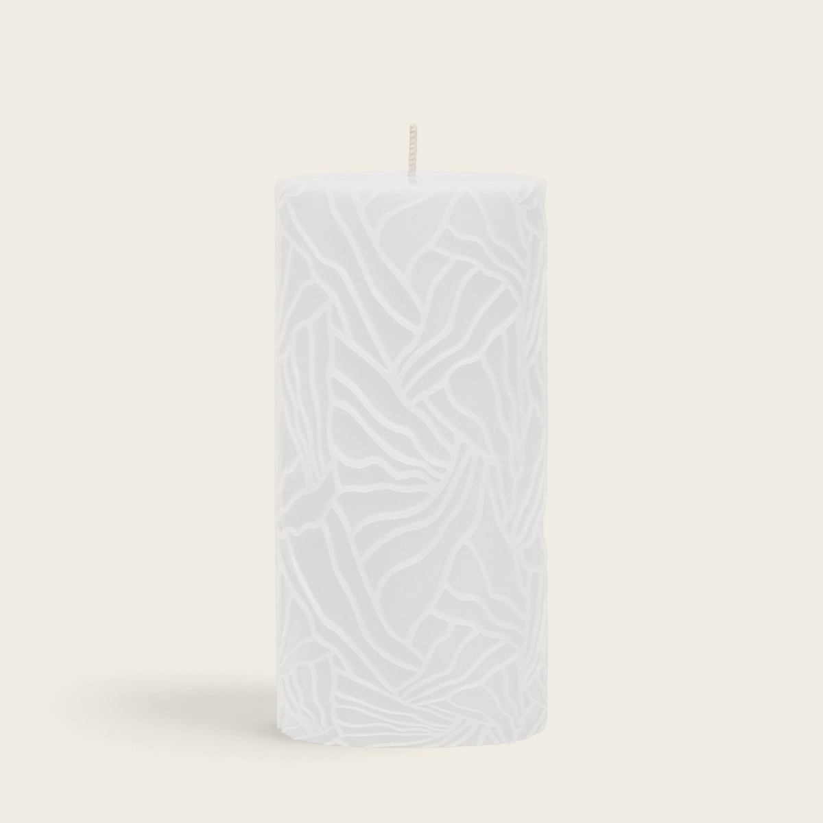 Riverdale white pillar candle with a textured wave pattern design, 7x14cm size for home decor.