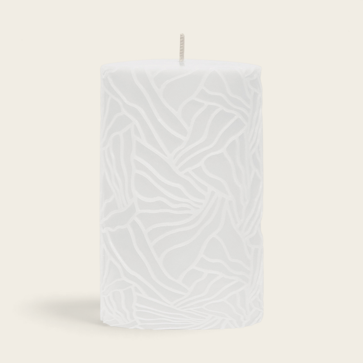 Riverdale white pillar candle with a textured wave pattern design for home decor