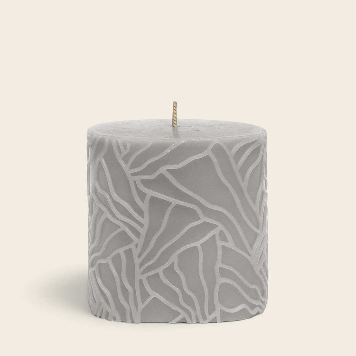Riverdale light grey Wave pillar candle with a textured oyster mushroom pattern, 9x9cm decorative wax candle.