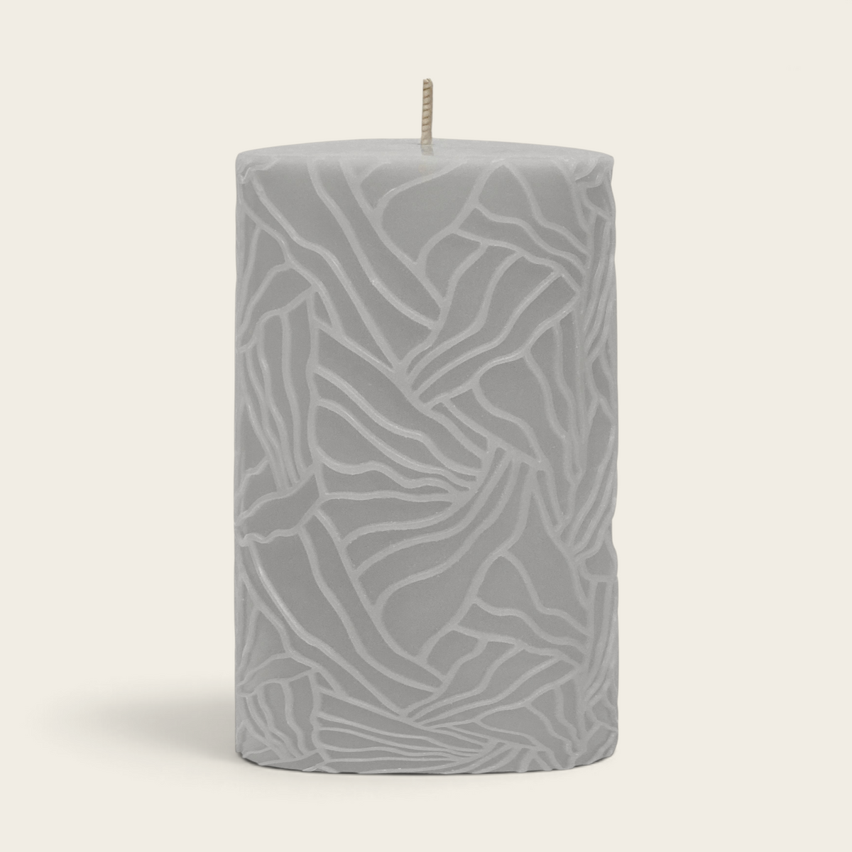 Riverdale light grey pillar candle with a textured wave pattern, 9x15cm size for elegant home decor.