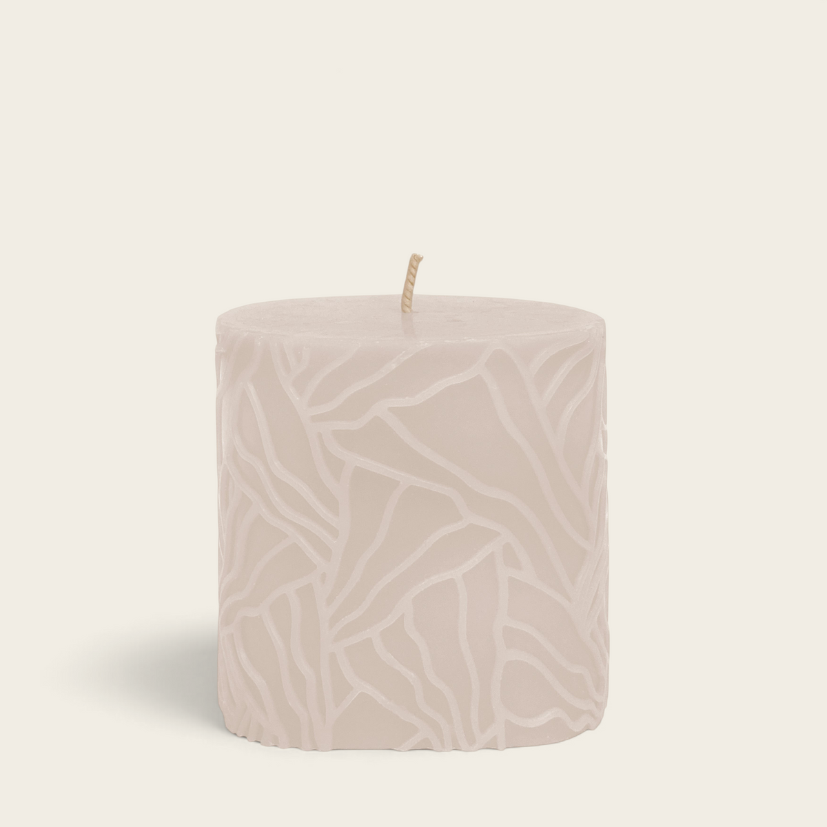 Riverdale Wave pillar candle in sand colour with a decorative textured abstract pattern