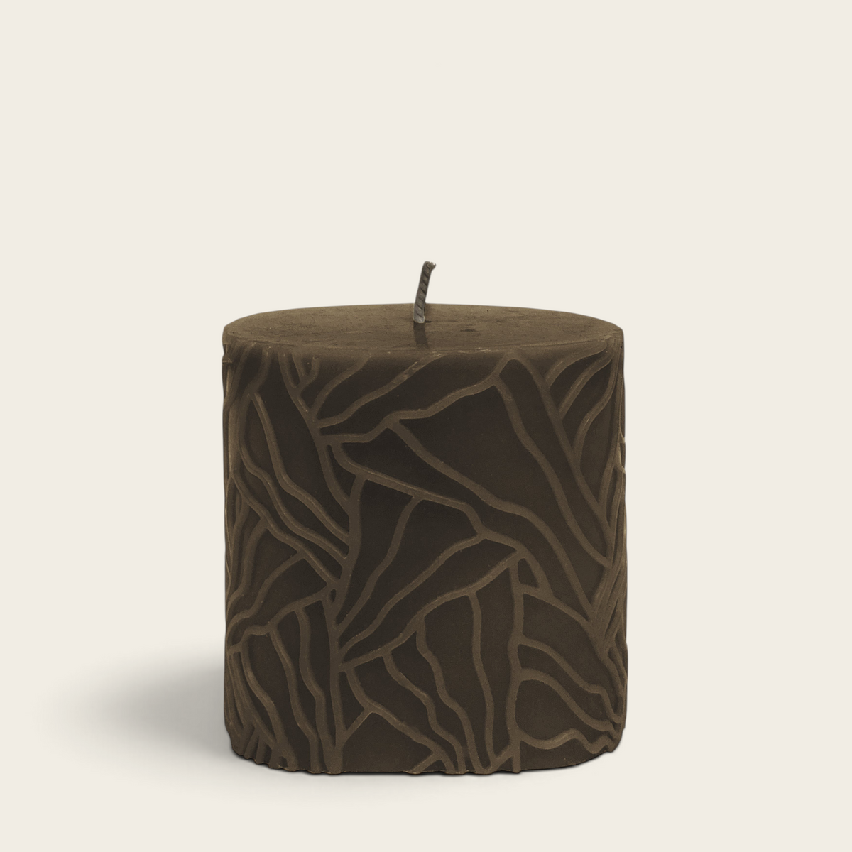 Riverdale brown pillar candle with a unique oyster mushroom inspired textured wave pattern