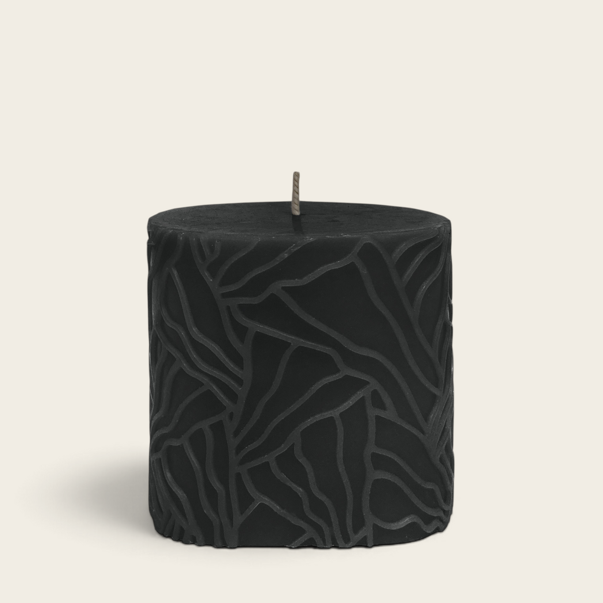 Riverdale Wave pillar candle in black with a textured, abstract wave pattern, 9x9cm size.