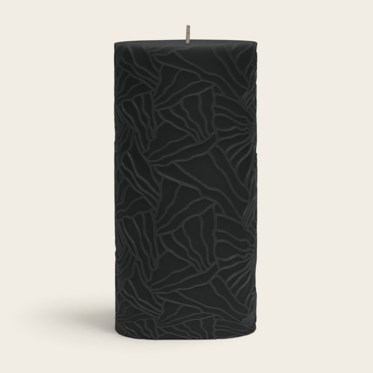 Riverdale Wave pillar candle in black with a textured oyster mushroom-inspired pattern, 9x20cm.