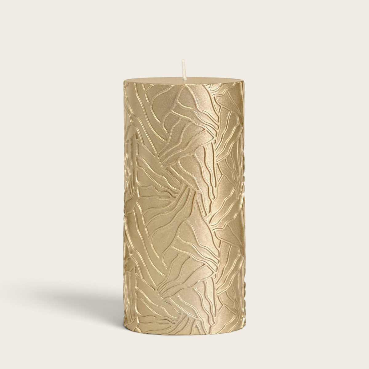 Riverdale gold pillar candle with a textured wave pattern, 7x14cm, perfect for elegant home decor.