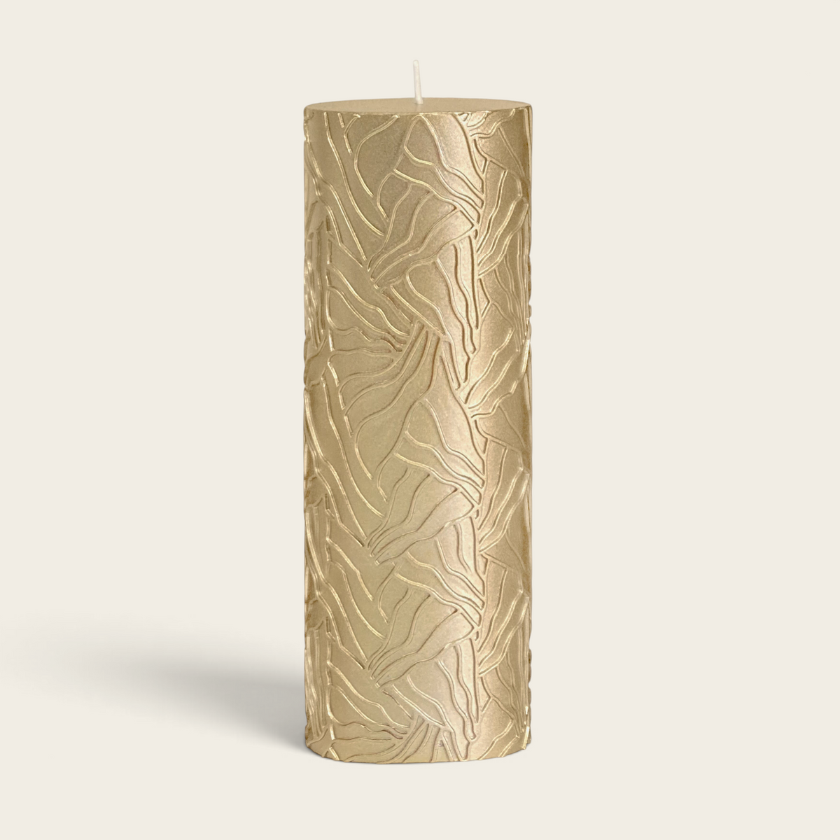 Riverdale gold pillar candle with a textured wave pattern, 7x20cm size for elegant home decor.