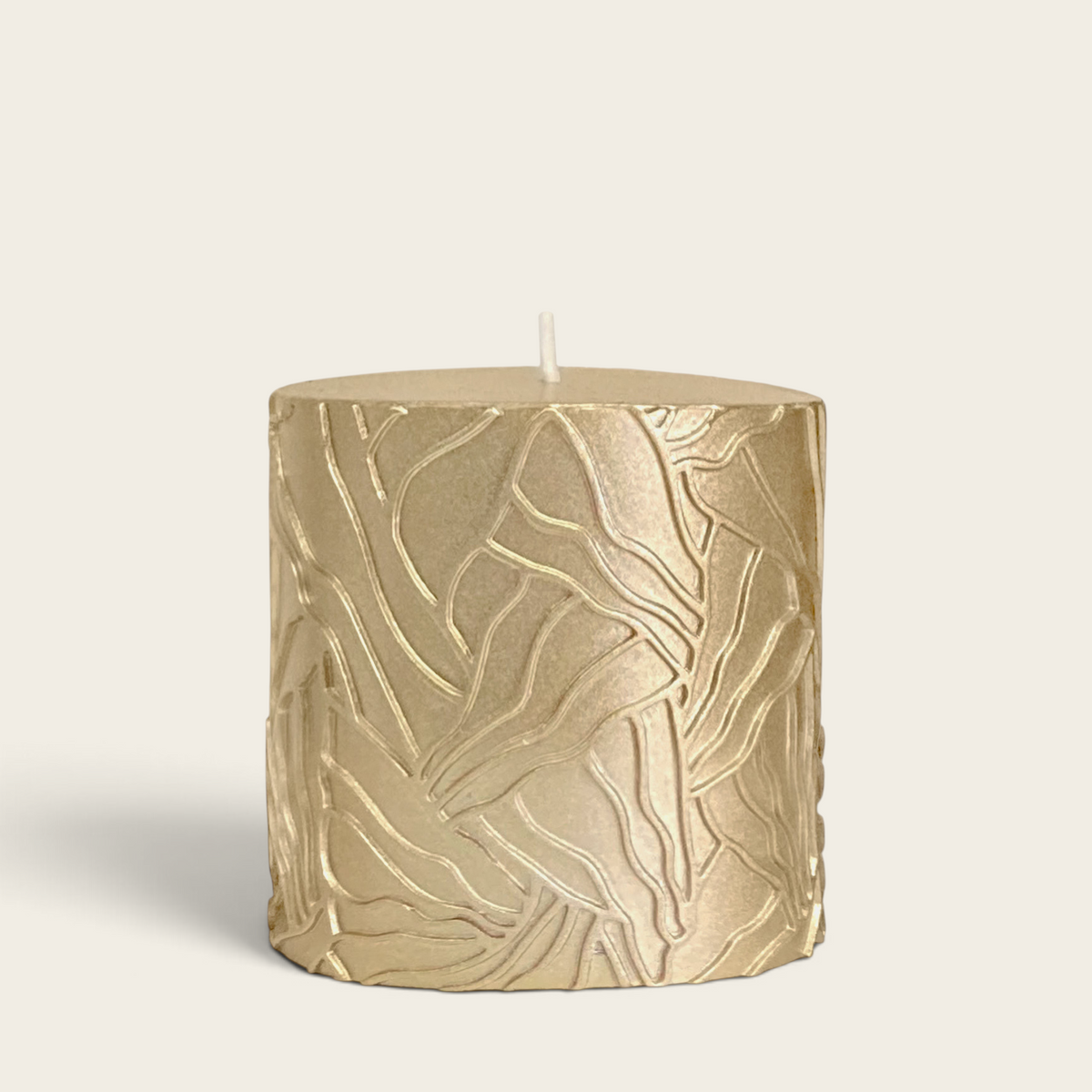 Riverdale gold pillar candle with a textured wave pattern, 9x9cm decorative wax candle for home styling.