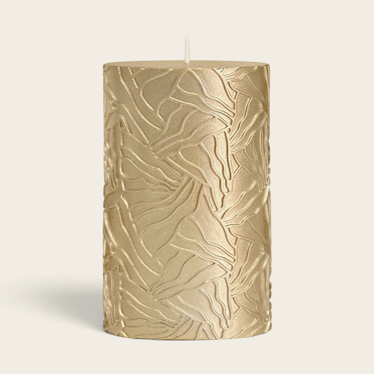 Riverdale gold pillar candle with a textured wave pattern, 9x15cm size for elegant home decor