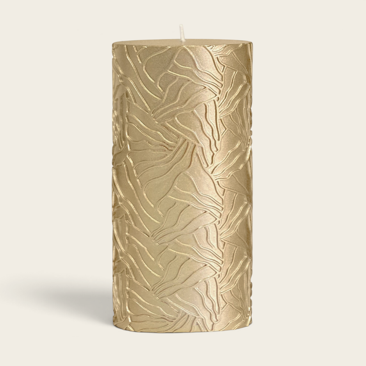 Riverdale gold pillar candle with a textured wave pattern design, 9x20cm size for elegant home decor.