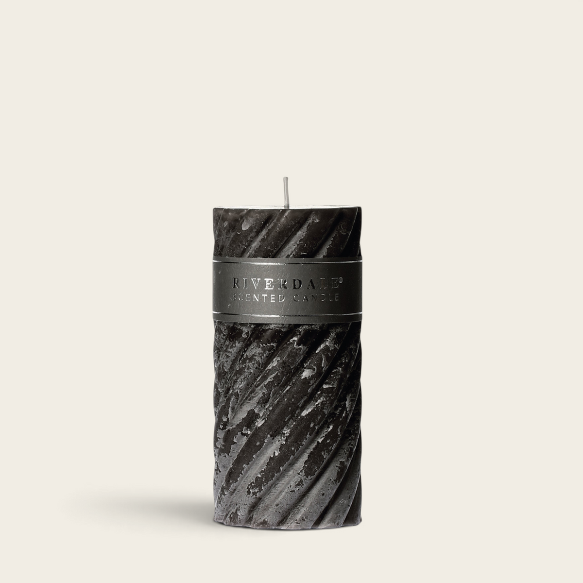 Riverdale Arabian Nights dark grey pillar candle with a textured swirl design and branded label