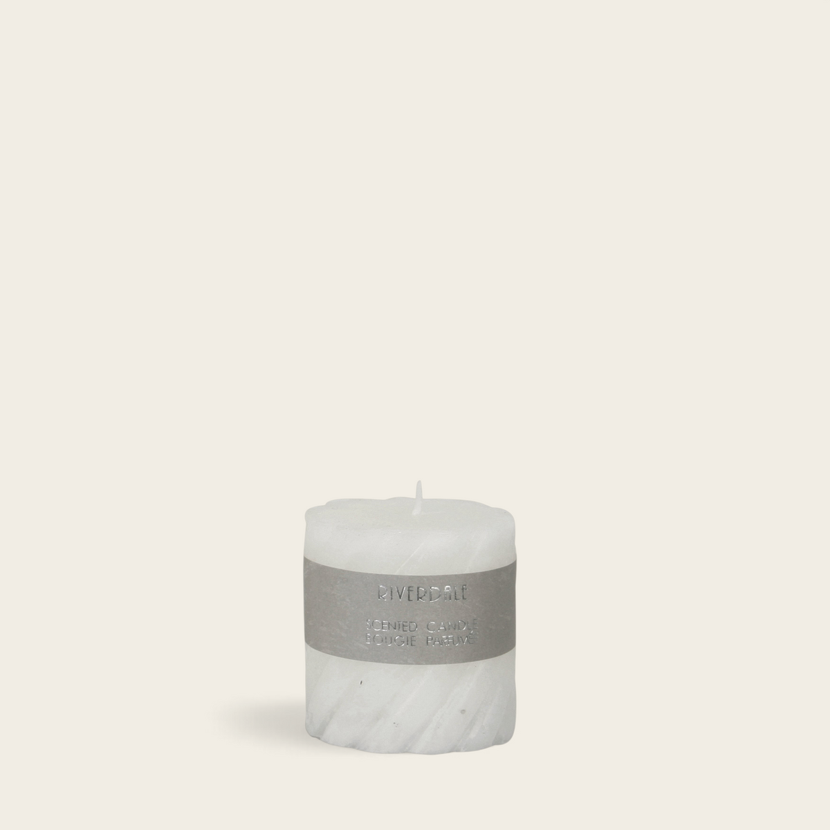 Riverdale white pillar candle with a decorative swirl texture and White Tea Ginger scent label