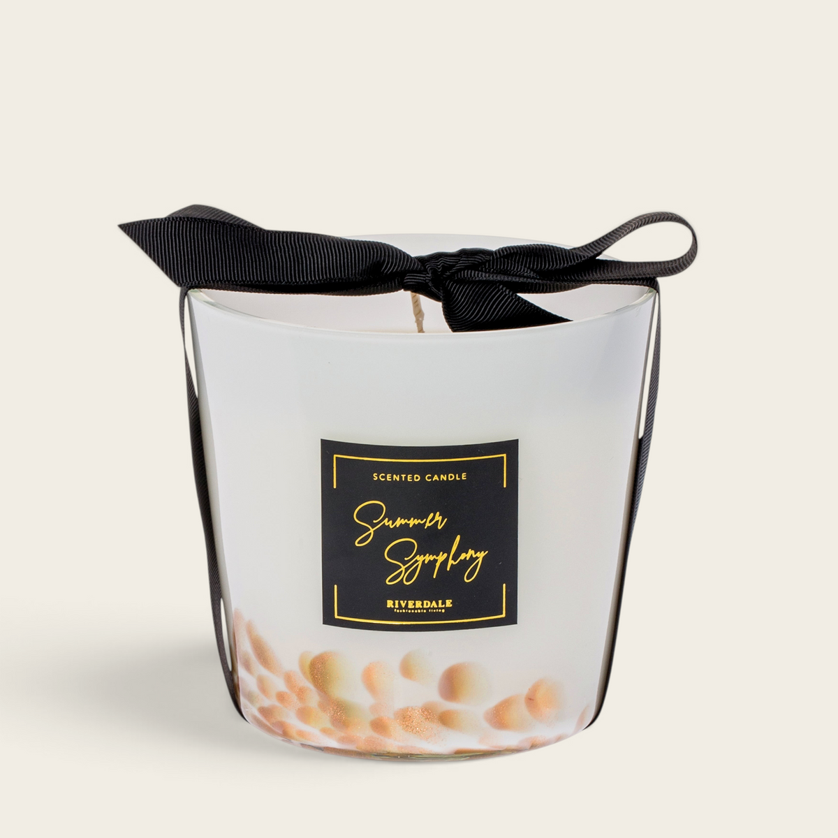 Riverdale Summer Symphony scented candle in a white glass jar with gold accents and a decorative black ribbon