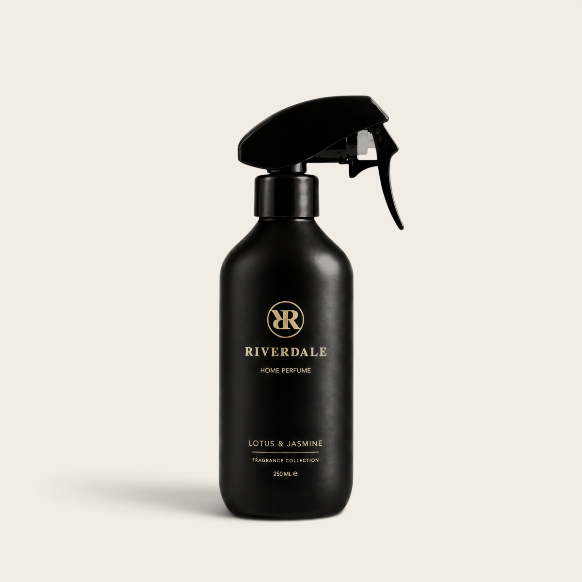 Riverdale Lotus & Jasmine home perfume in a matte black 250ml spray bottle with gold logo branding.