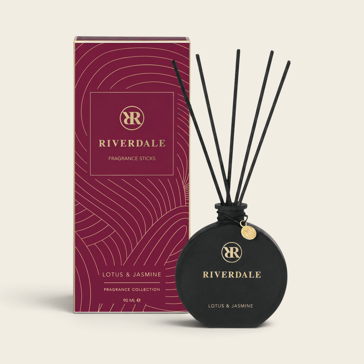 Riverdale Lotus & Jasmine fragrance sticks in a round black glass bottle with black reeds and burgundy gift box.