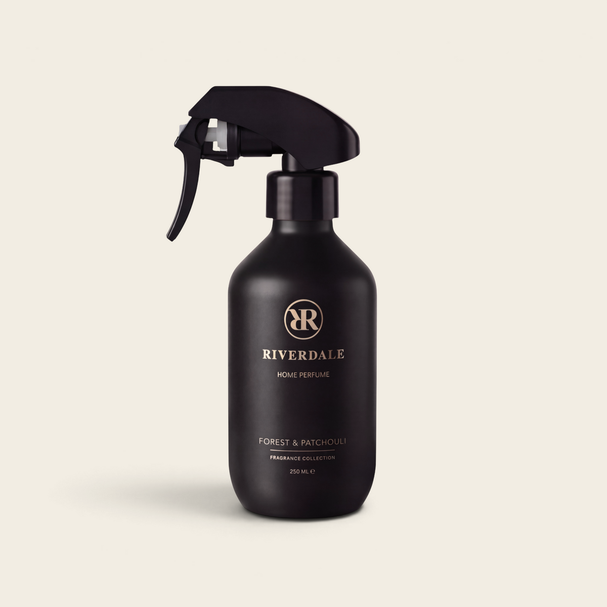 Riverdale Forest & Patchouli home perfume spray in a sleek matte black 250ml bottle with a trigger nozzle.