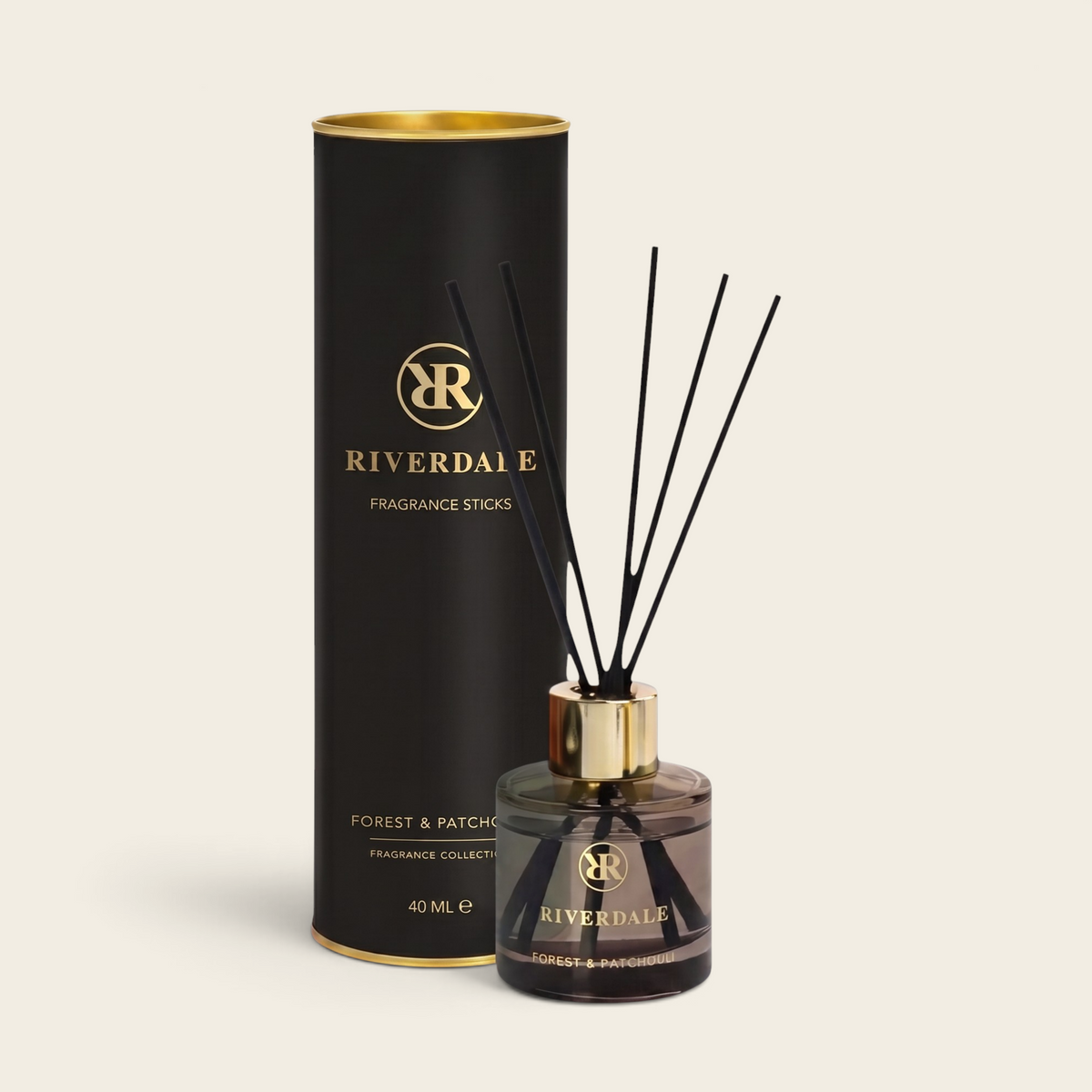 Riverdale Forest & Patchouli fragrance sticks in a black glass bottle with gold accents and matching gift tube