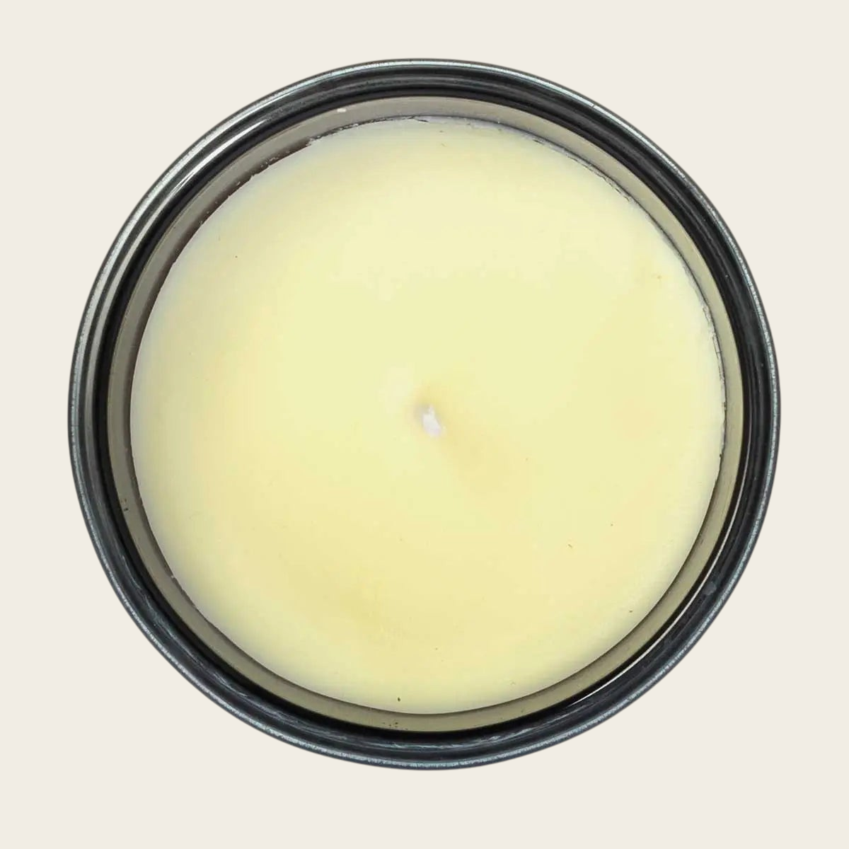 Riverdale Boutique scented candle in a dark pot with cream wax, featuring Forest and Patchouli fragrance notes