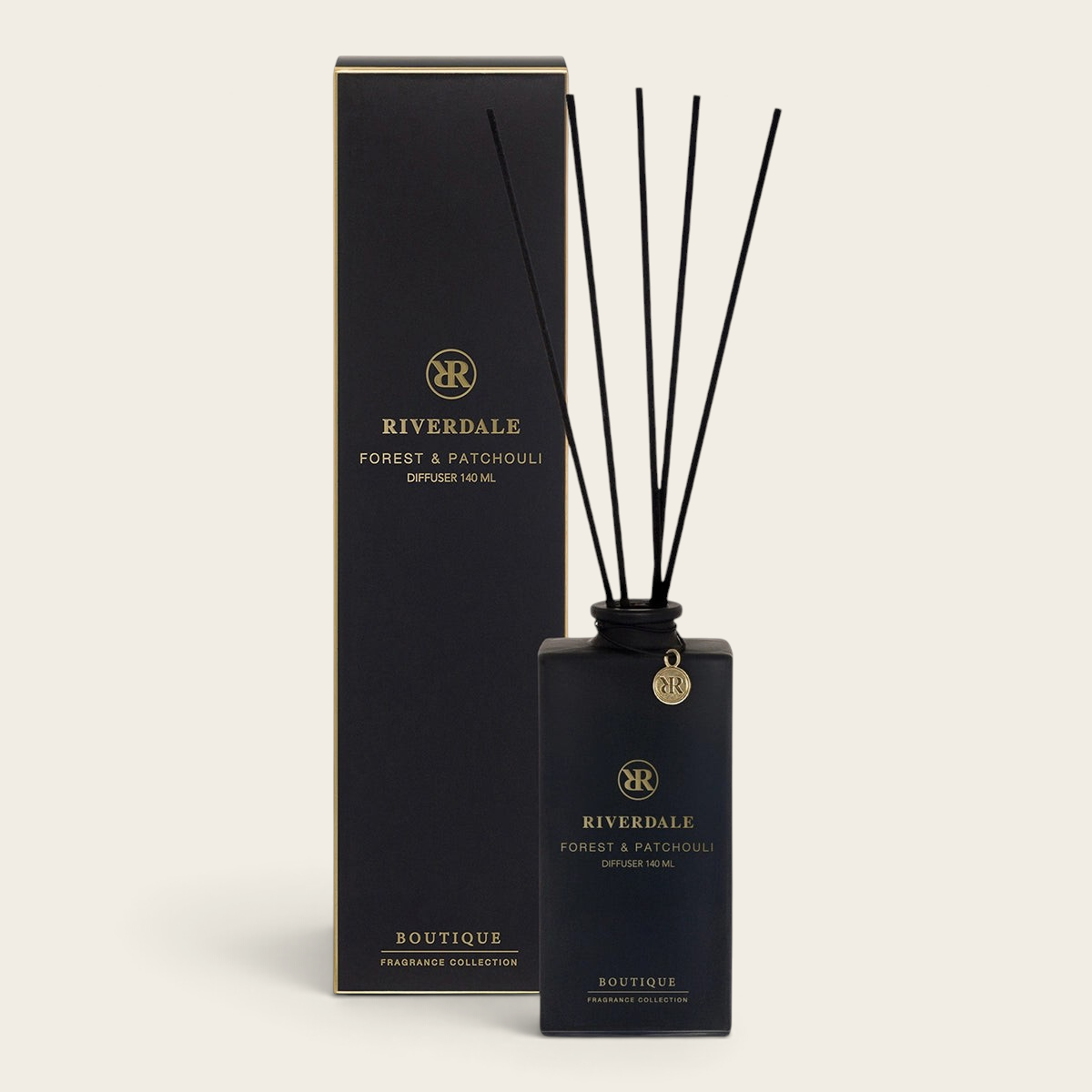 Riverdale Boutique Forest & Patchouli reed diffuser with black glass bottle, black reeds, and matching gift box.