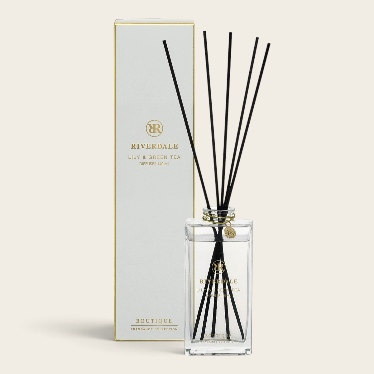 Riverdale Boutique Lily & Green Tea fragrance diffuser with black reeds and elegant glass bottle and packaging box