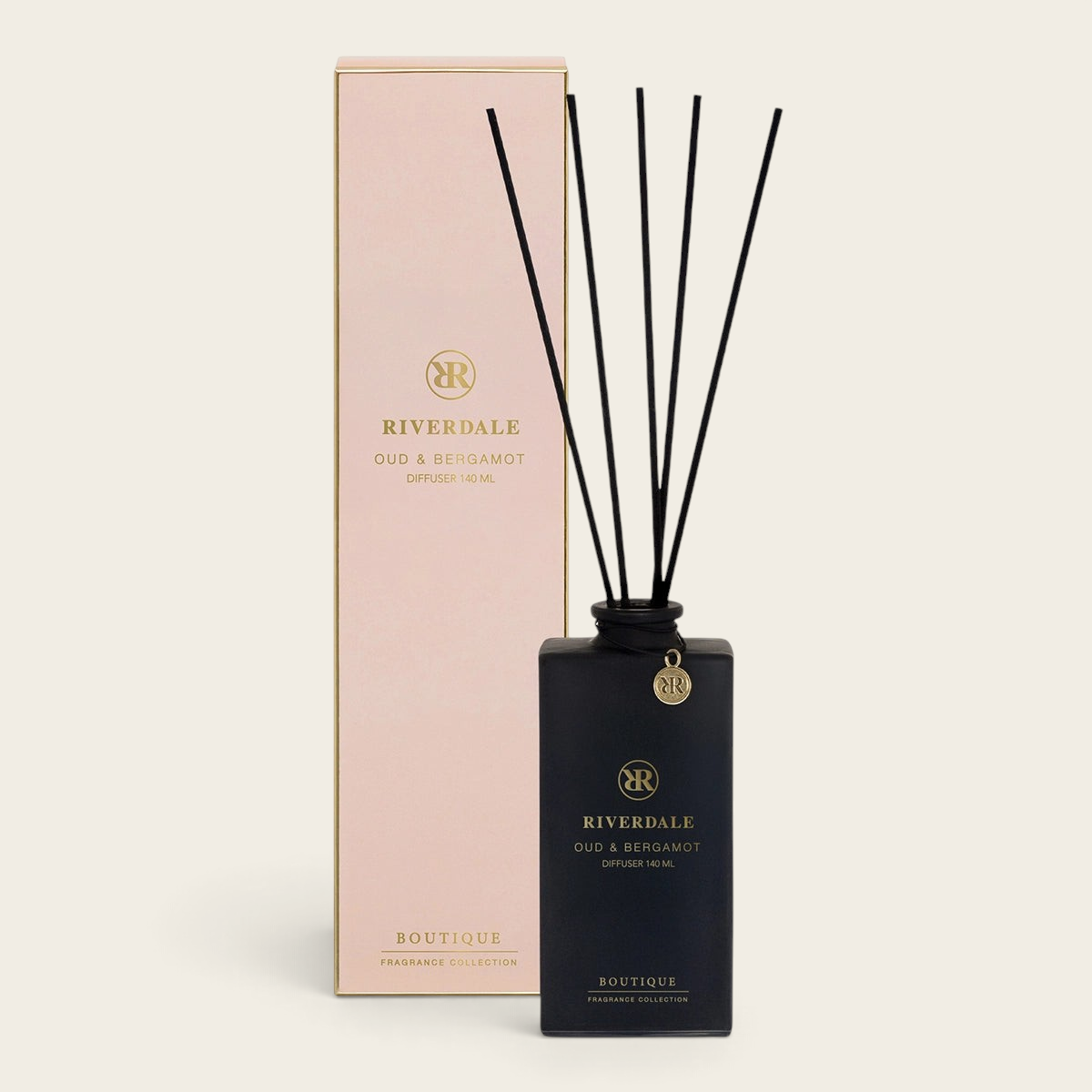 Riverdale Boutique Oud & Bergamot reed diffuser in a black glass bottle with black sticks and matching gift box.