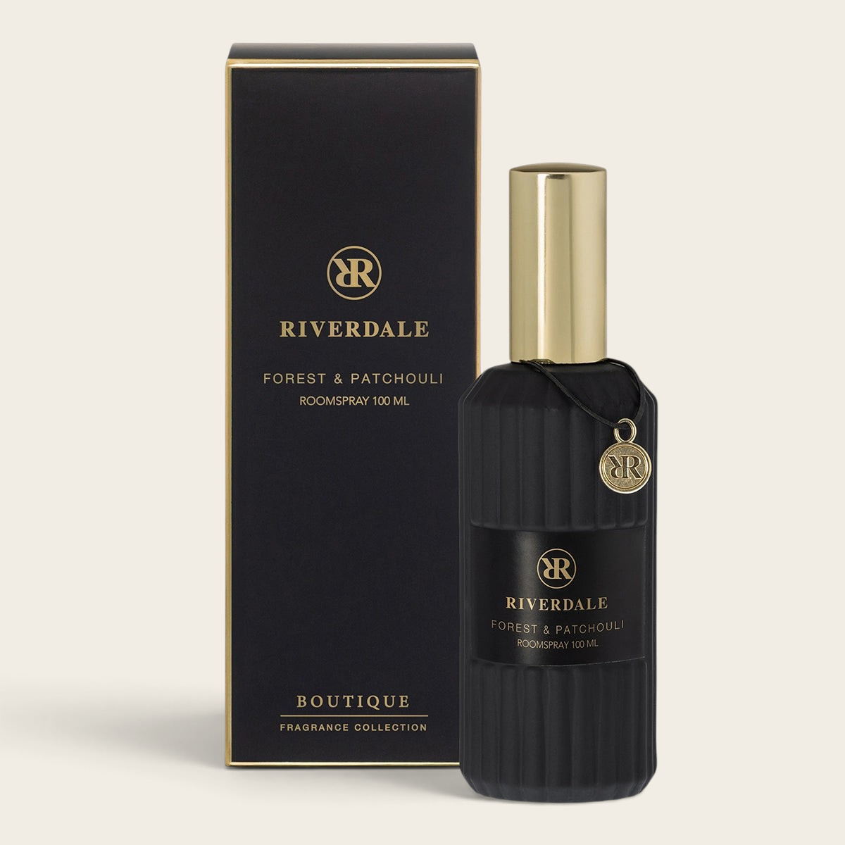 Riverdale Boutique Forest & Patchouli roomspray in a black ribbed glass bottle with a gold cap and matching gift box.