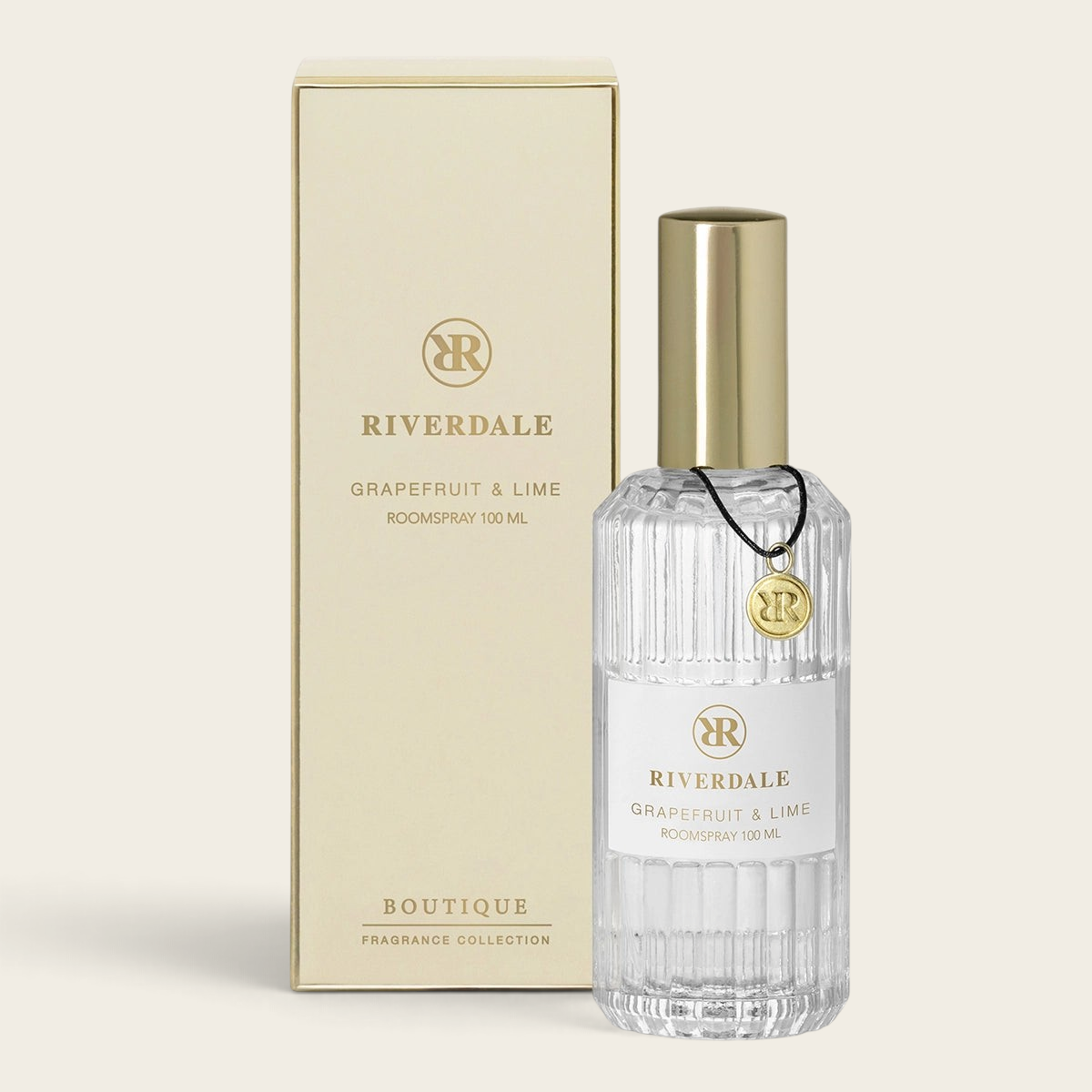 Riverdale Boutique Grapefruit & Lime roomspray in a ribbed glass bottle with gold cap and matching gift box.