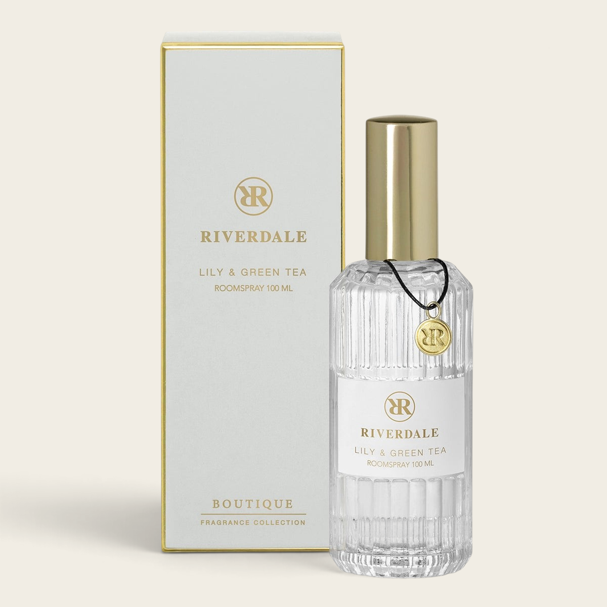 Riverdale Boutique Lily & Green Tea roomspray in a ribbed glass bottle with gold cap and matching white gift box.