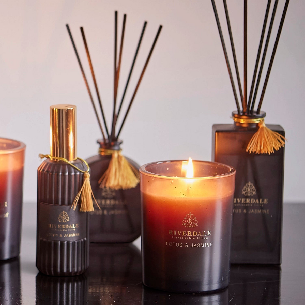 Riverdale Boutique Lotus and Jasmine roomspray and scented candle set with elegant black glass and gold accents