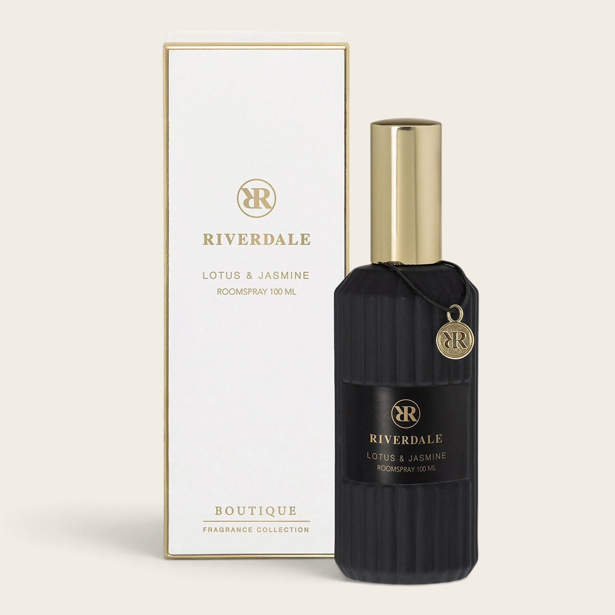 Riverdale Boutique Lotus & Jasmine roomspray in a black fluted glass bottle with gold cap and matching gift box.