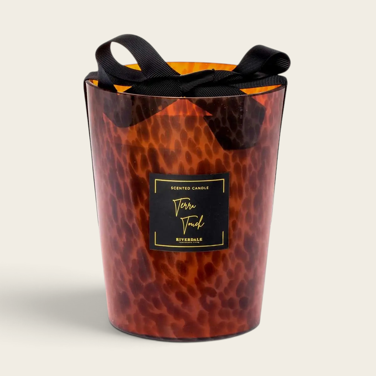 Riverdale Sense L Terra Touch scented candle in a brown leopard print glass jar with a decorative black ribbon