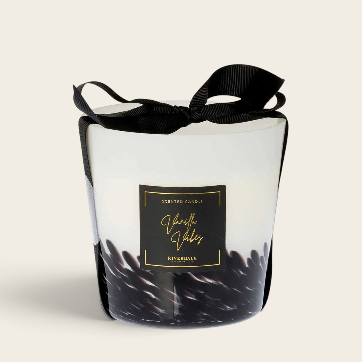 Riverdale Vanilla Vibes scented candle in a white and black decorative glass jar with a black ribbon bow