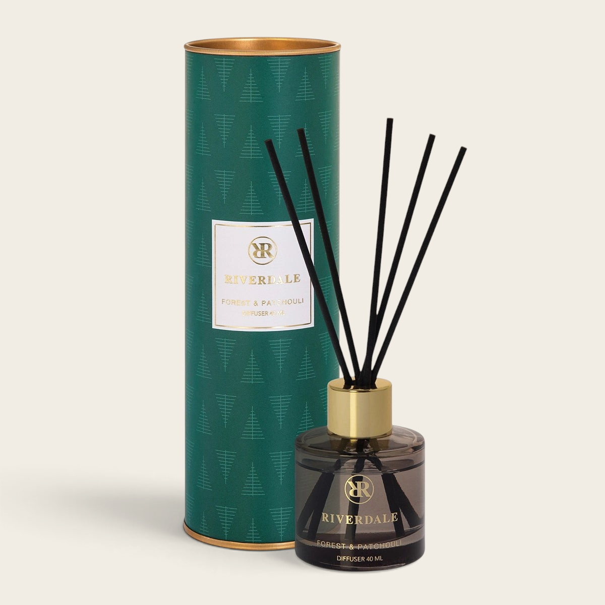Riverdale Forest & Patchouli reed diffuser set with black sticks in a glass bottle and green festive gift tube