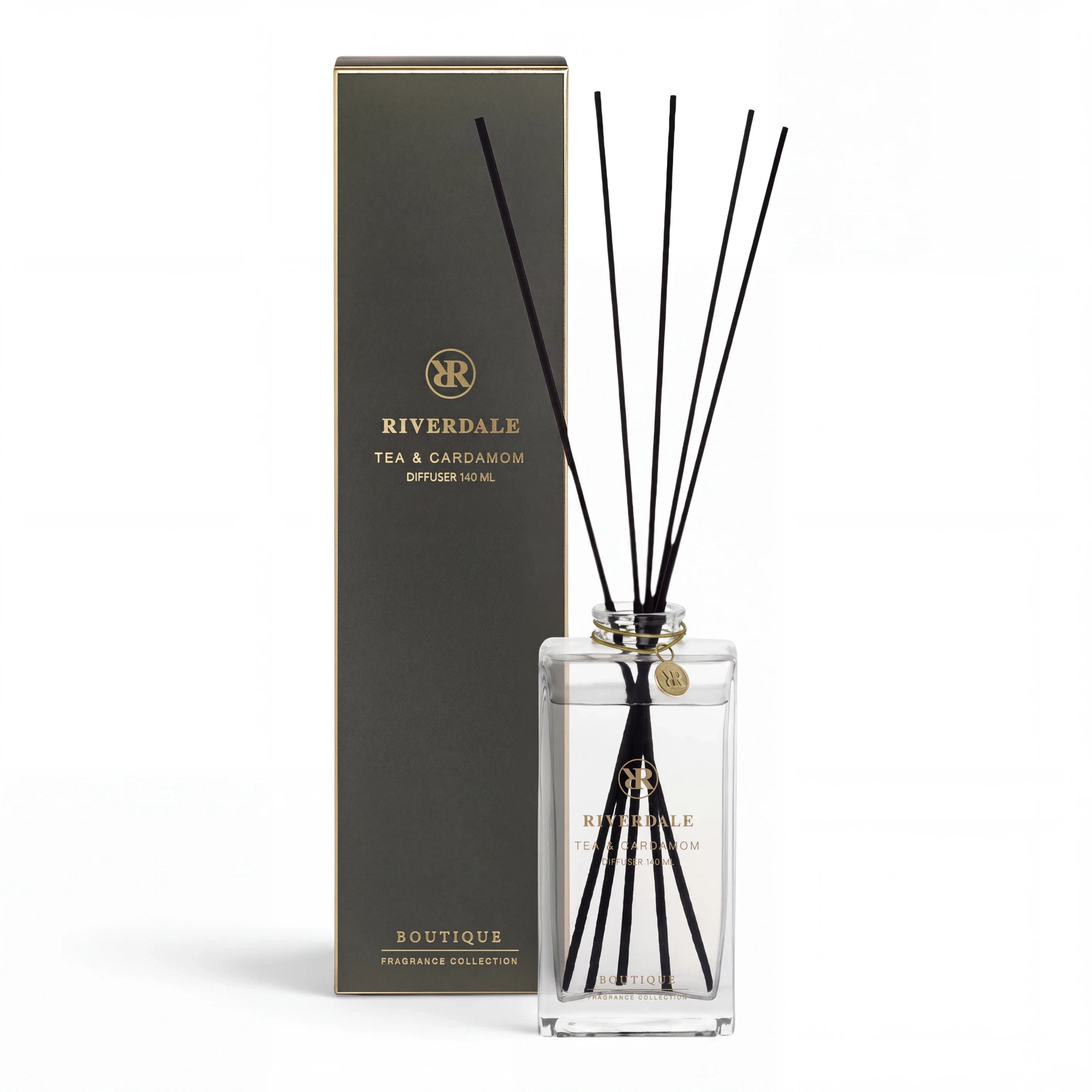 Riverdale Boutique tea and cardamom fragrance diffuser with black reeds and elegant glass bottle in gift box