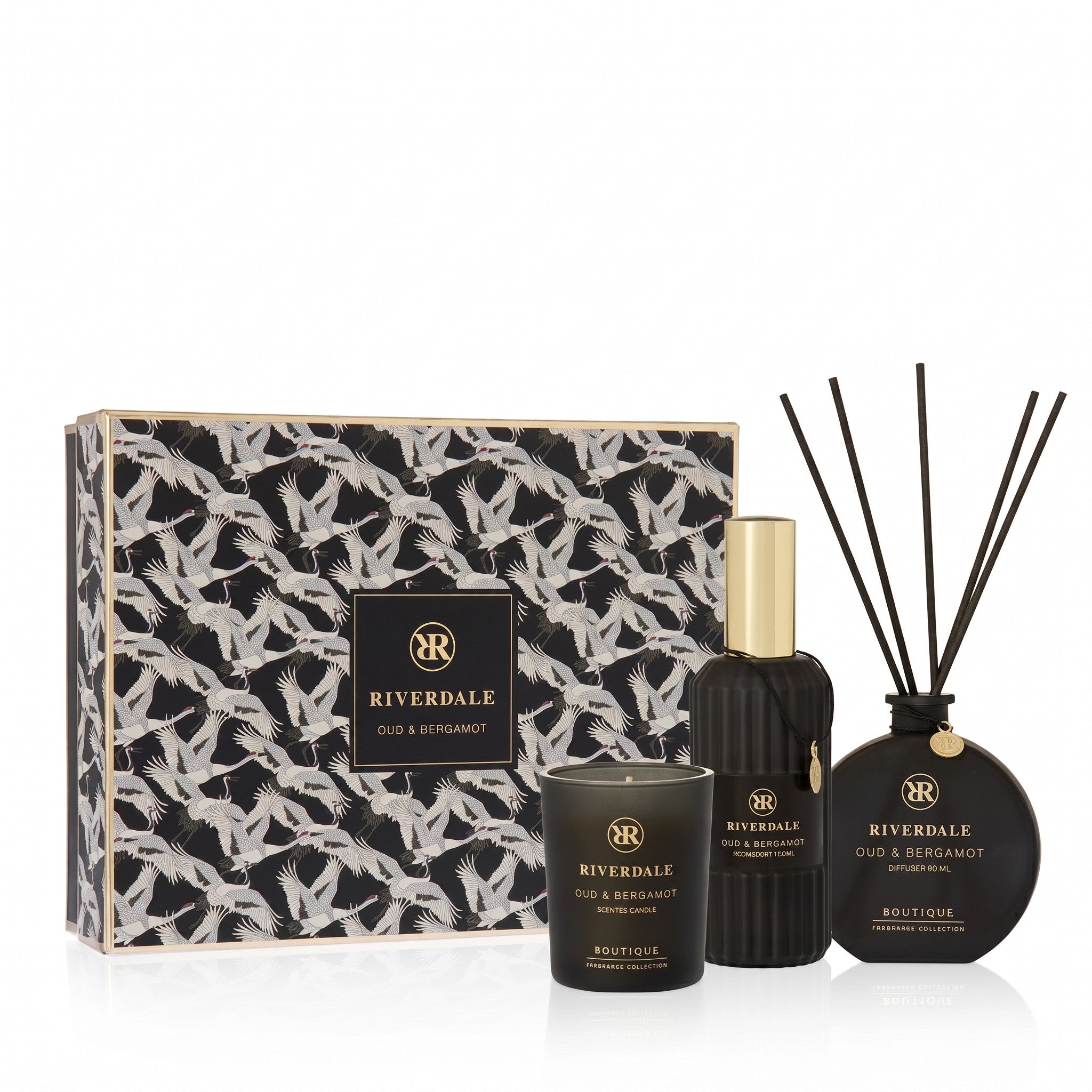 Riverdale Oud & Bergamot gift set featuring a scented candle, room spray, and reed diffuser in a patterned box.